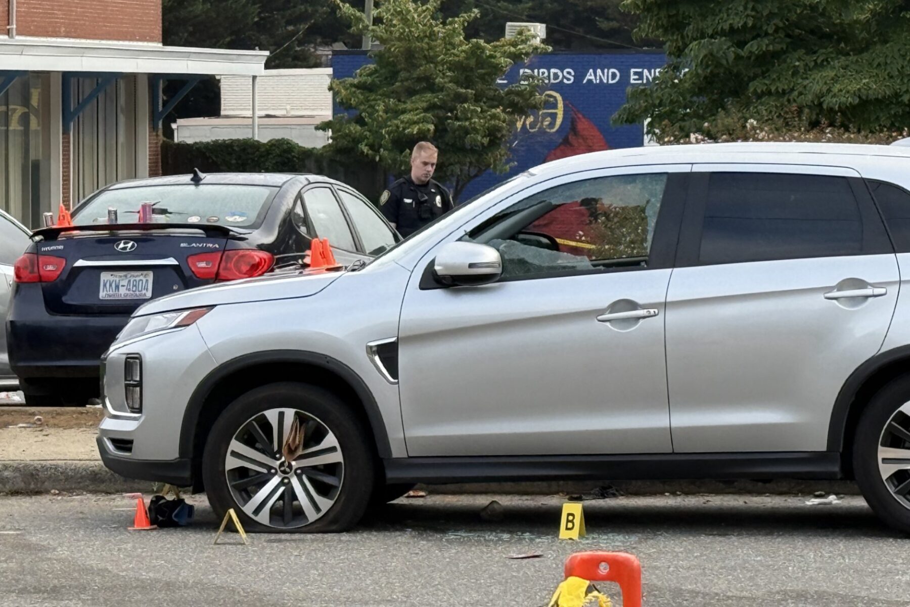 Asheville police officers and forensic investigators process the scene of a deadly shooting along Biltmore Avenue and Short Coxe Avenue early Sunday morning.