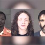 Three mugshots of suspects against gray walls, shown left to right: a Black man in an orange striped prison uniform, a white woman with curly hair and a neck tattoo, and a bearded man with dark hair.