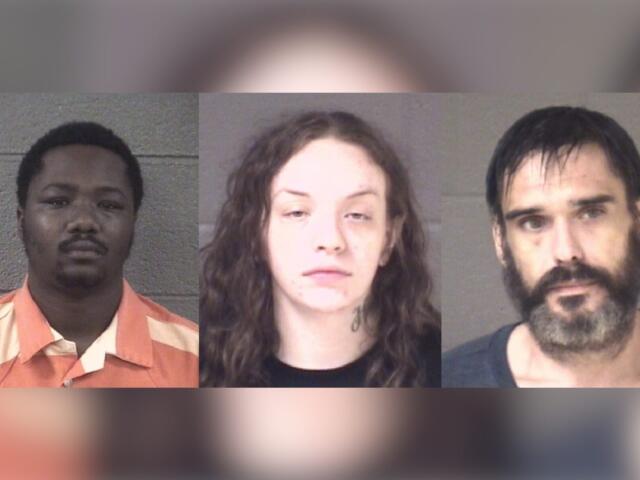 Three mugshots of suspects against gray walls, shown left to right: a Black man in an orange striped prison uniform, a white woman with curly hair and a neck tattoo, and a bearded man with dark hair.