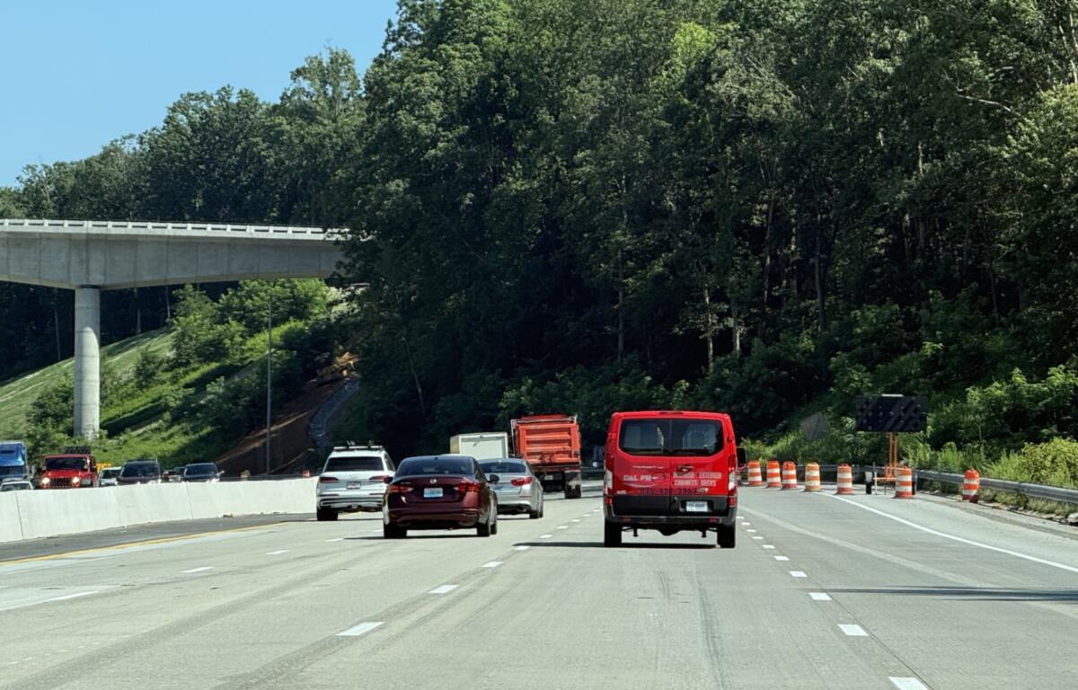 Traffic moves through the newly opened four-lane westbound section of Interstate 26 near the Blue Ridge Parkway on Friday, marking a major milestone in the N.C. Department of Transportation's I-26 widening project.