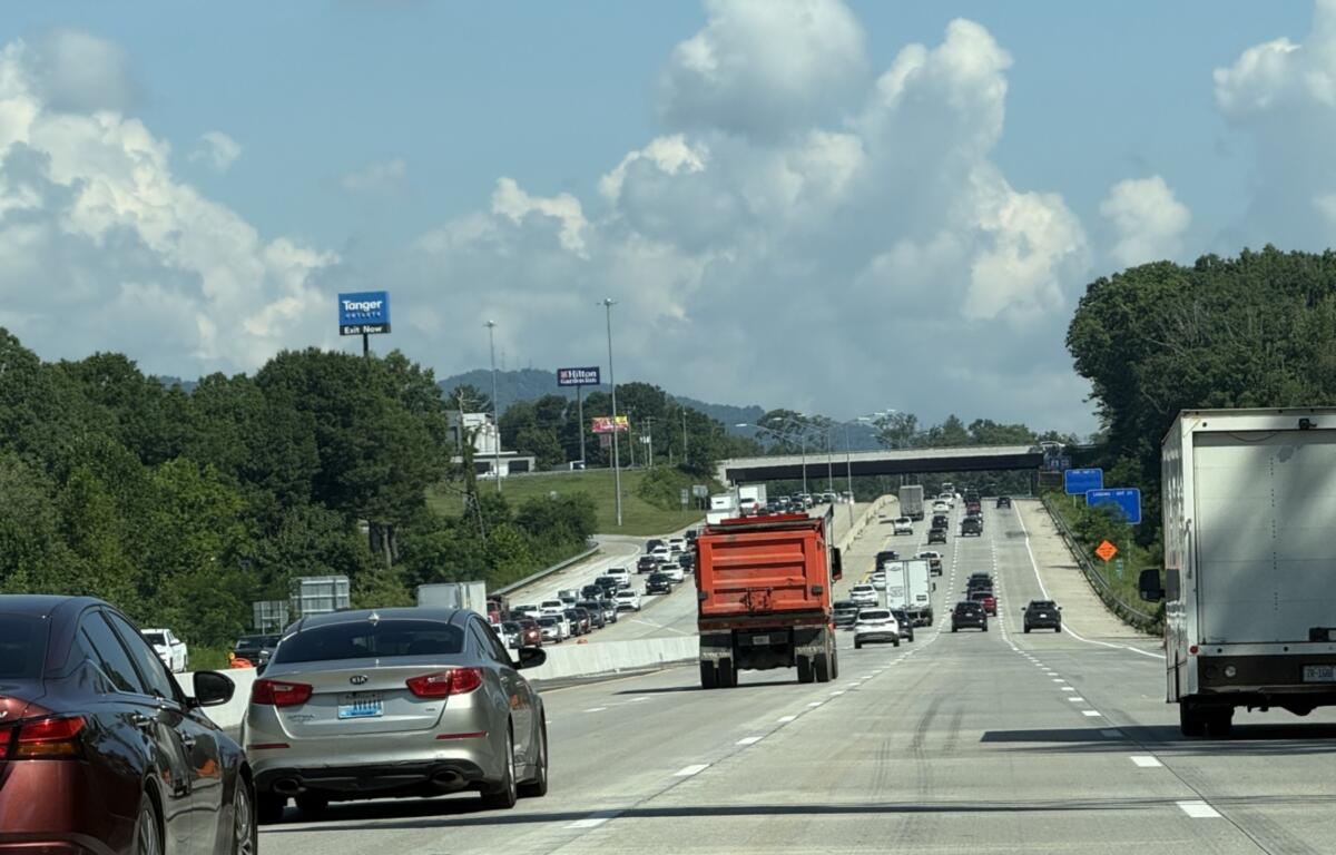 Traffic moves through the newly opened four-lane westbound section of Interstate 26 near the Brevard Road exit on Friday, marking a major milestone in the N.C. Department of Transportation's I-26 widening project.