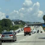 Traffic moves through the newly opened four-lane westbound section of Interstate 26 near the Brevard Road exit on Friday, marking a major milestone in the N.C. Department of Transportation's I-26 widening project.
