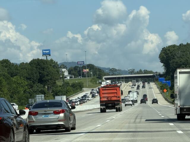 Traffic moves through the newly opened four-lane westbound section of Interstate 26 near the Brevard Road exit on Friday, marking a major milestone in the N.C. Department of Transportation's I-26 widening project.