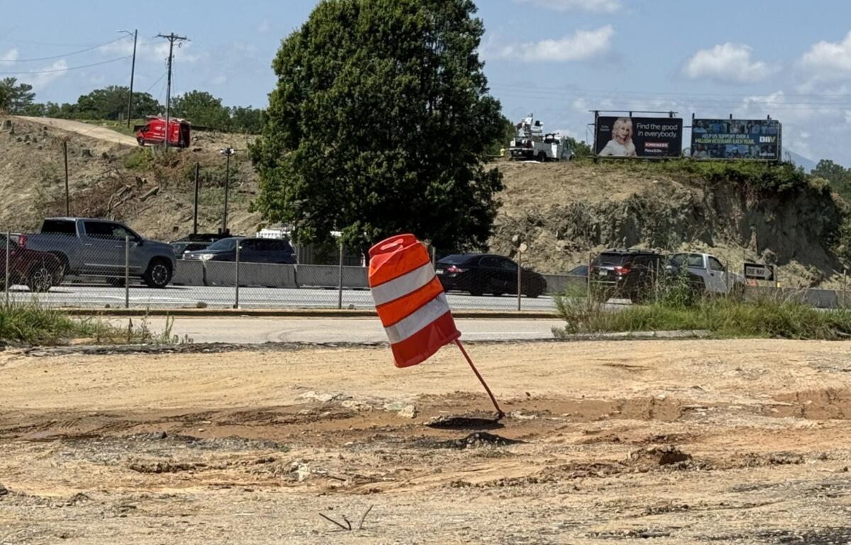 NCDOT crews continue clearing land along the Interstate 26 Connector corridor in Asheville as construction ramps up on the multibillion-dollar highway project.