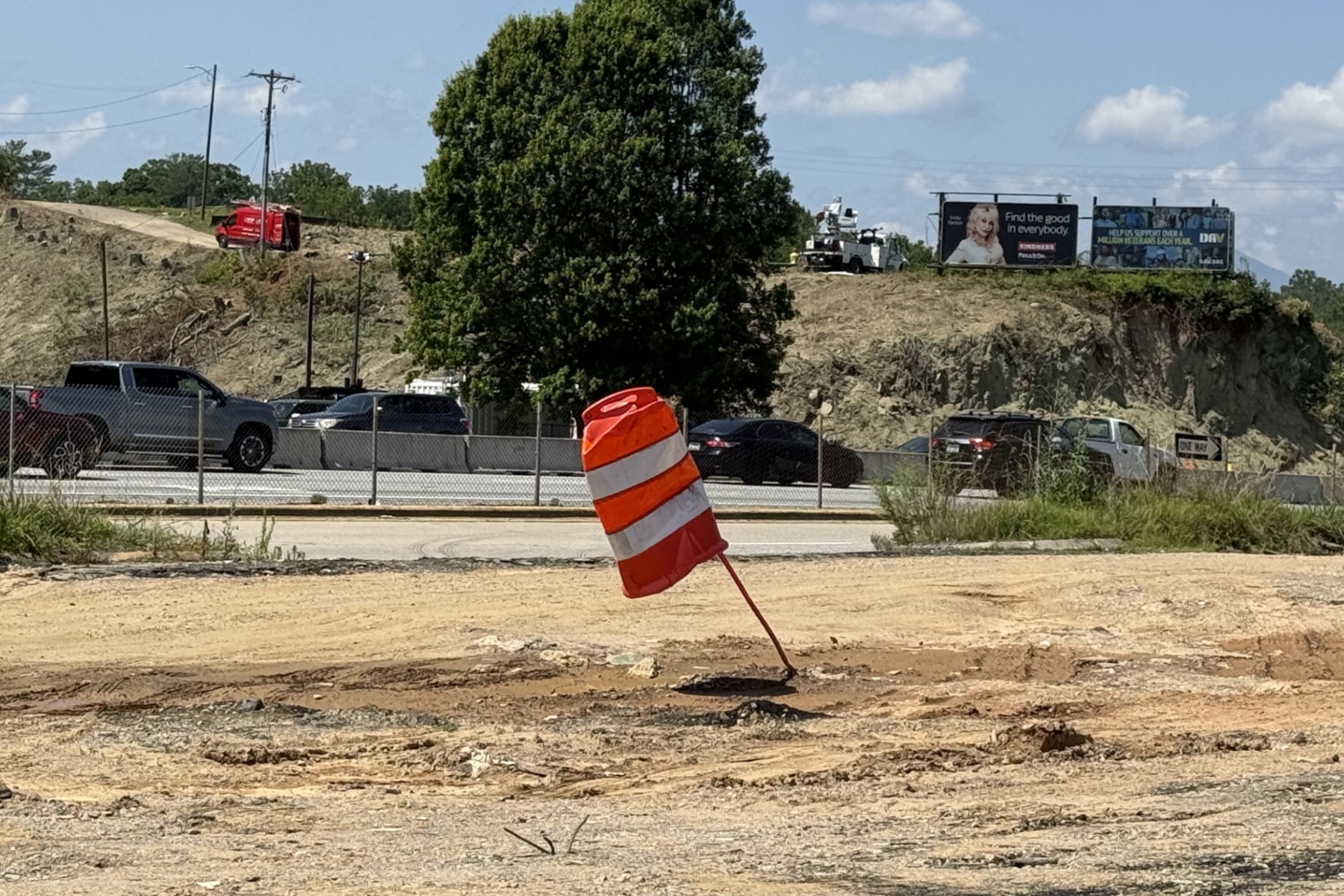 NCDOT crews continue clearing land along the Interstate 26 Connector corridor in Asheville as construction ramps up on the multibillion-dollar highway project.