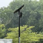 A Flock automated license plate reader camera is seen at the entrance/exit of Lowe's of Smokey Park Highway in Asheville.