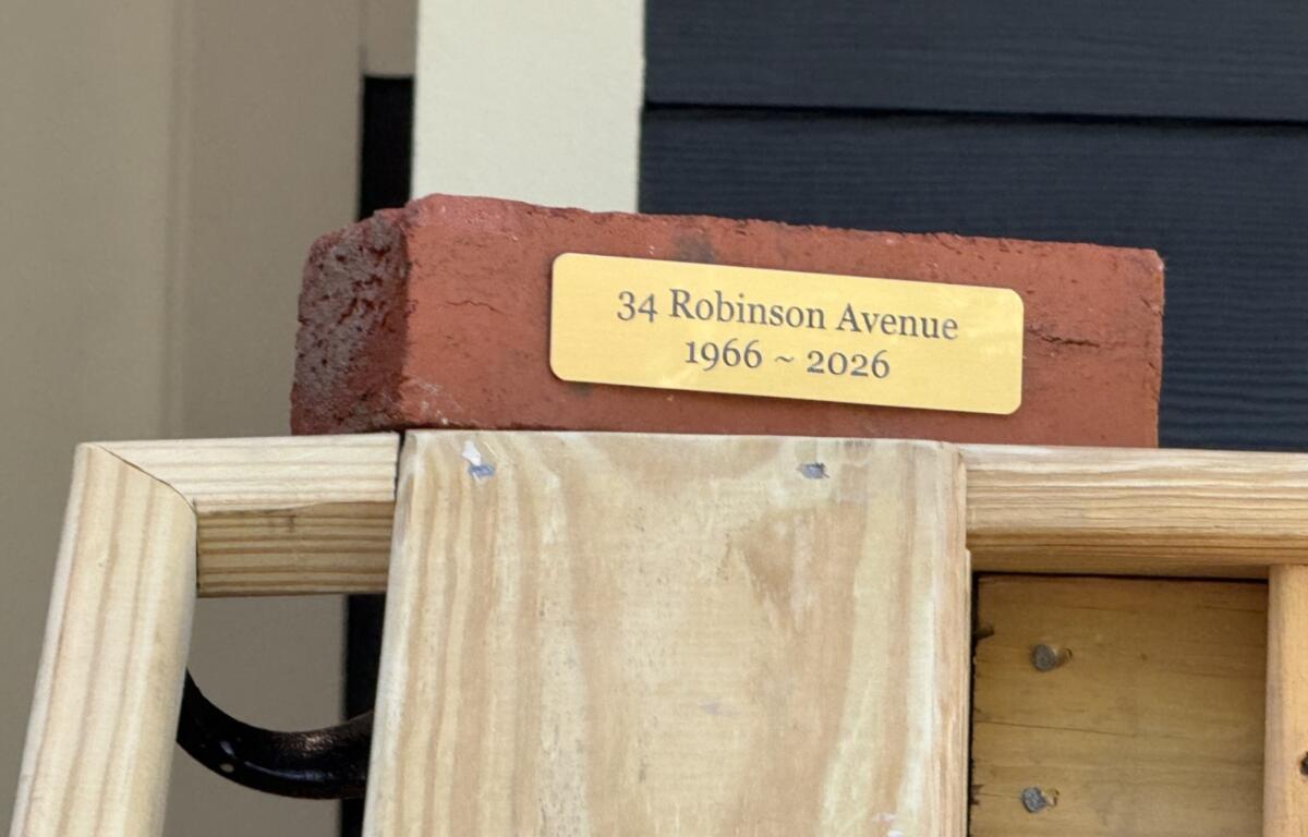 Builders gave Velma Chapman a brick salvaged from her former Robinson Avenue home, where she lived for nearly 30 years before it was damaged by Tropical Storm Helene.