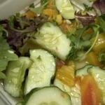 A fresh salad made with raw fruits and vegetables. Health officials are urging residents to wash produce thoroughly and consider cooking it when possible as North Carolina tracks a rise in cyclosporiasis cases, including four confirmed cases in Buncombe County.
