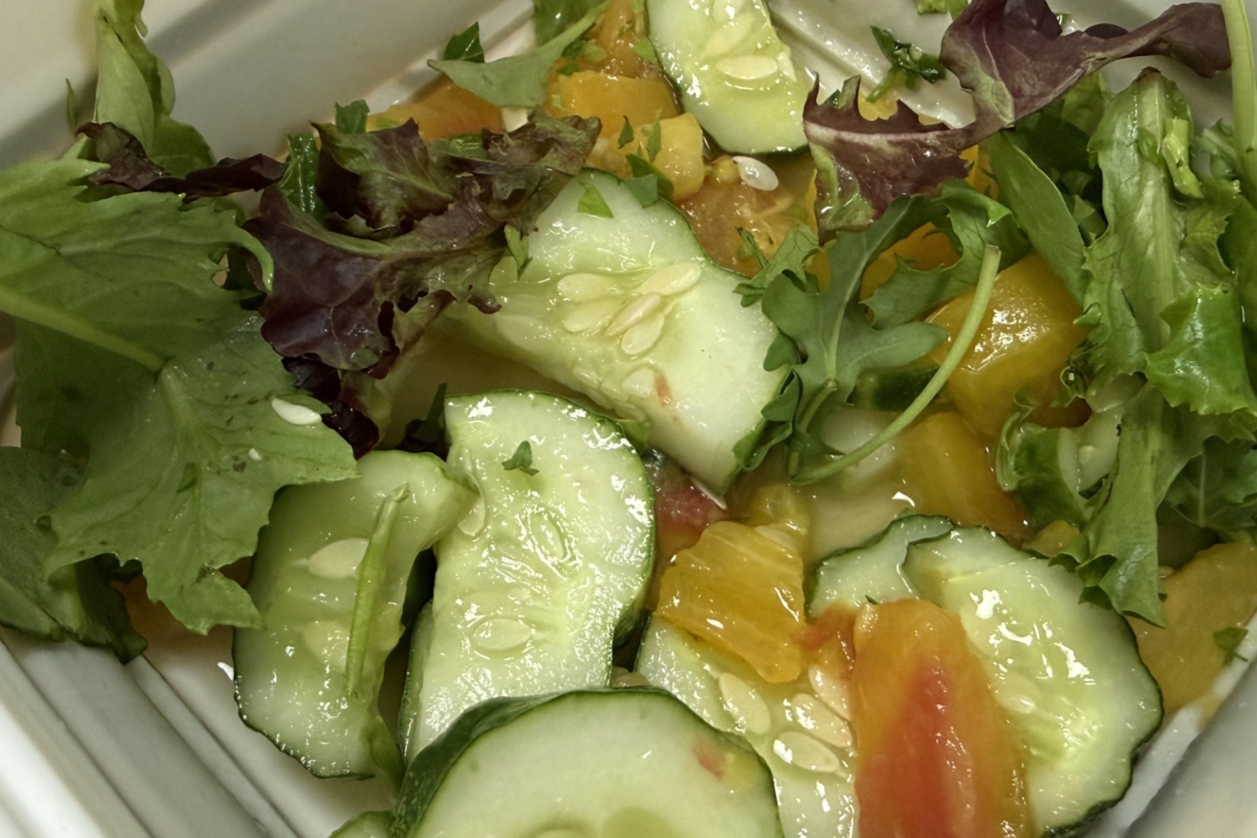 A fresh salad made with raw fruits and vegetables. Health officials are urging residents to wash produce thoroughly and consider cooking it when possible as North Carolina tracks a rise in cyclosporiasis cases, including four confirmed cases in Buncombe County.