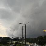 Dark storm clouds hang over West Asheville on Tuesday evening as severe thunderstorms swept across Buncombe County, bringing damaging winds, downed trees and widespread power outages.
