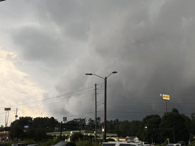 Dark storm clouds hang over West Asheville on Tuesday evening as severe thunderstorms swept across Buncombe County, bringing damaging winds, downed trees and widespread power outages.