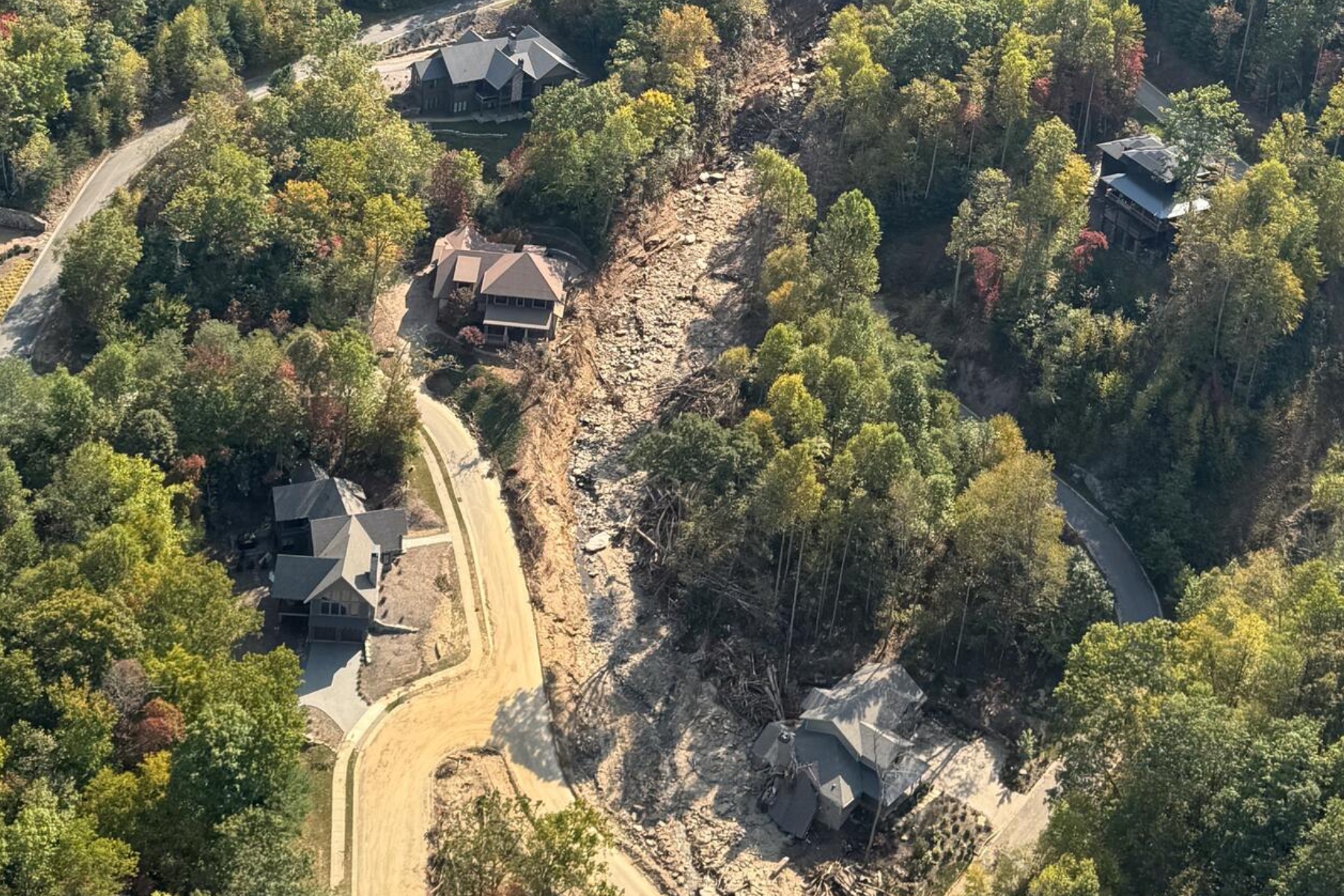 Oblique aerial view of a landslide near Black Mountain, North Carolina triggered by intense rainfall during Hurricane Helene in fall 2024. The photograph was collected during a U.S. Geological Survey aerial reconnaissance flight documenting widespread landsliding and flooding associated with the storm.
