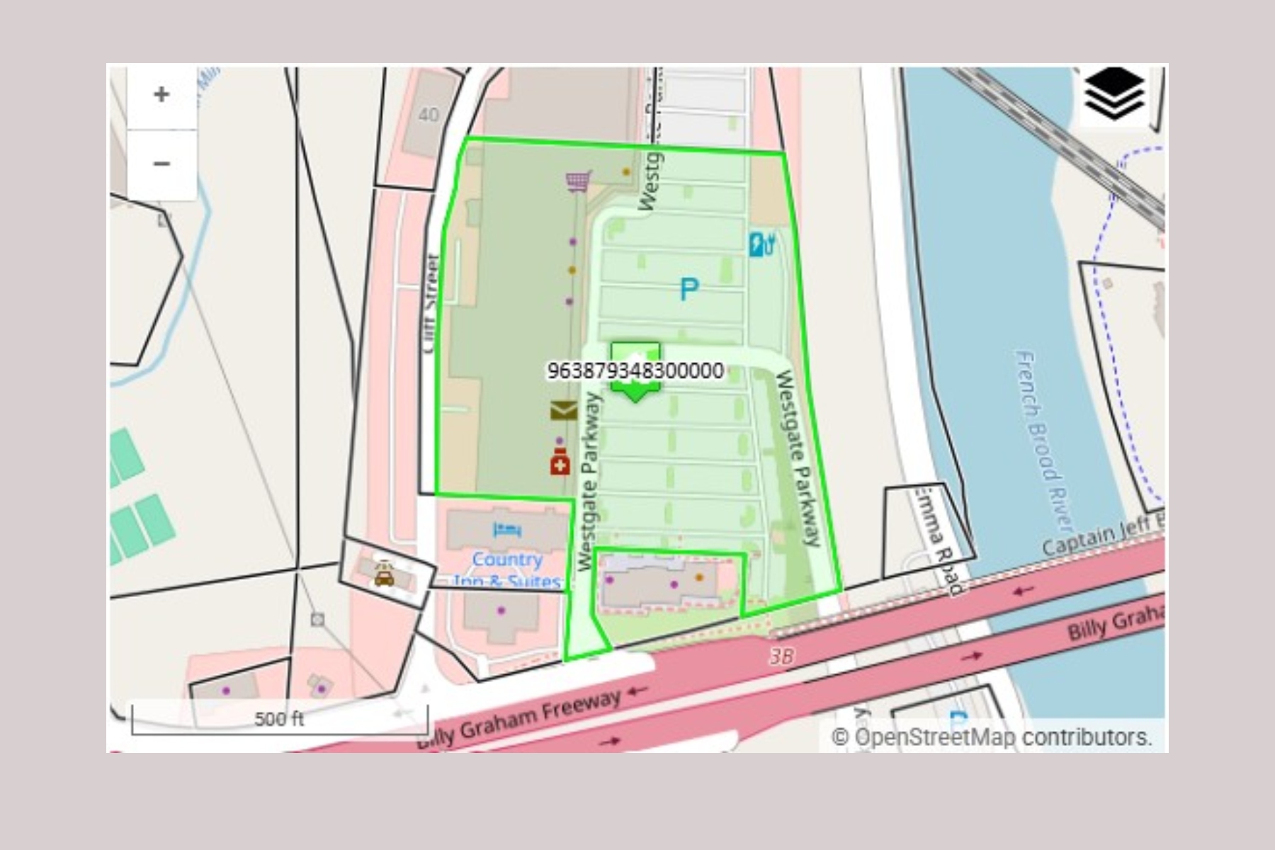 OpenStreetMap-style map with a bright green polygon outlining a block along Westgate Park, near a river and the Billy Graham Freeway; shows a parking area and nearby amenities.