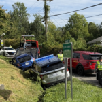 Two vehicles are shown in a ditch along New Leicester Highway near Gilbert Road Tuesday morning as North Carolina State Highway Patrol and Buncombe County Sheriff's Office deputies responded to the scene.