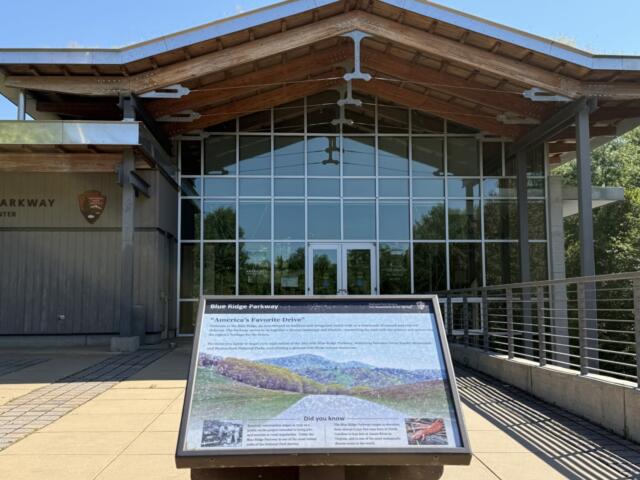 The Blue Ridge Parkway Visitor Center near Asheville features exhibits about the Parkway's natural and cultural history. A leaked National Park Service database identifies some Blue Ridge Parkway signs and interpretive exhibits for review.