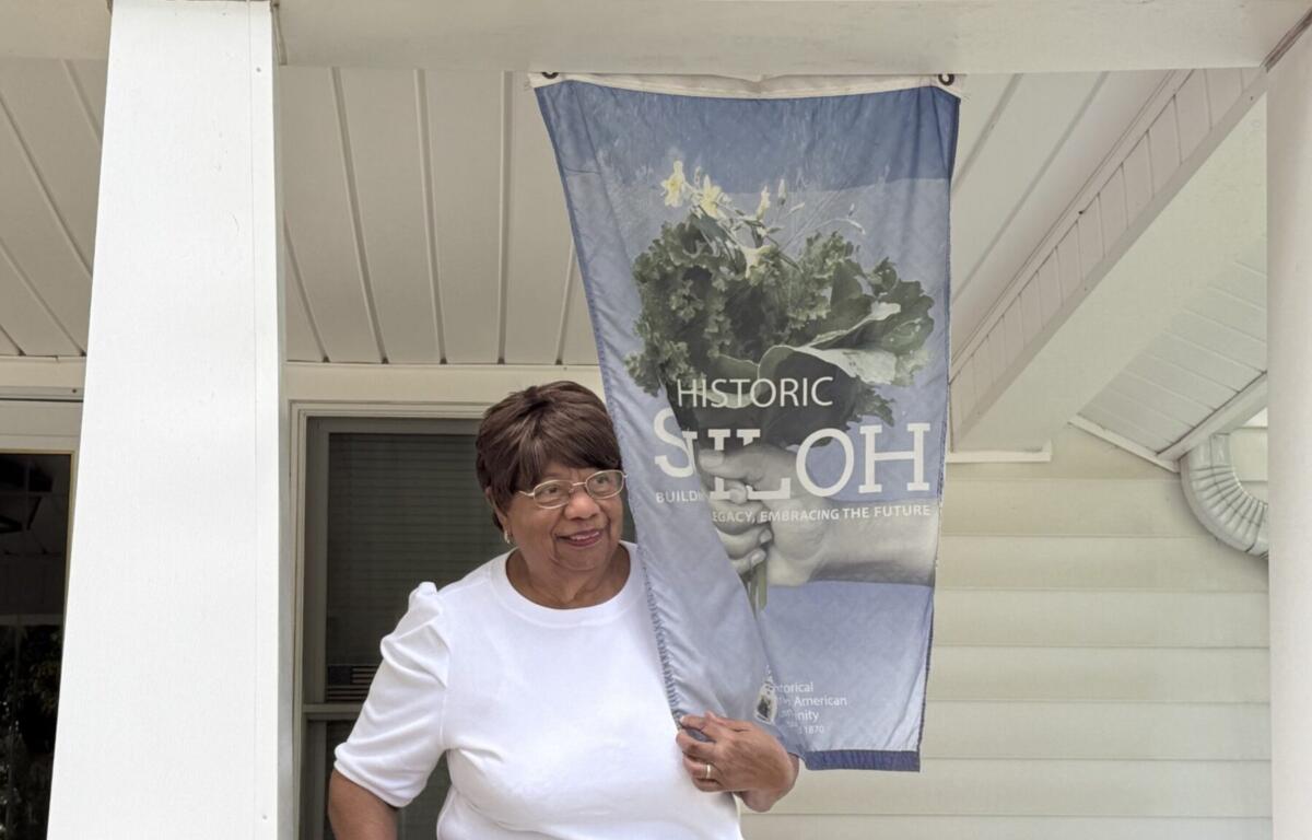 Norma Baines, a longtime Shiloh resident, discusses concerns about development, neighborhood infrastructure and the ability of older residents to remain in their homes during a neighborhood walk Wednesday, Aug. 12, 2026, in Asheville.