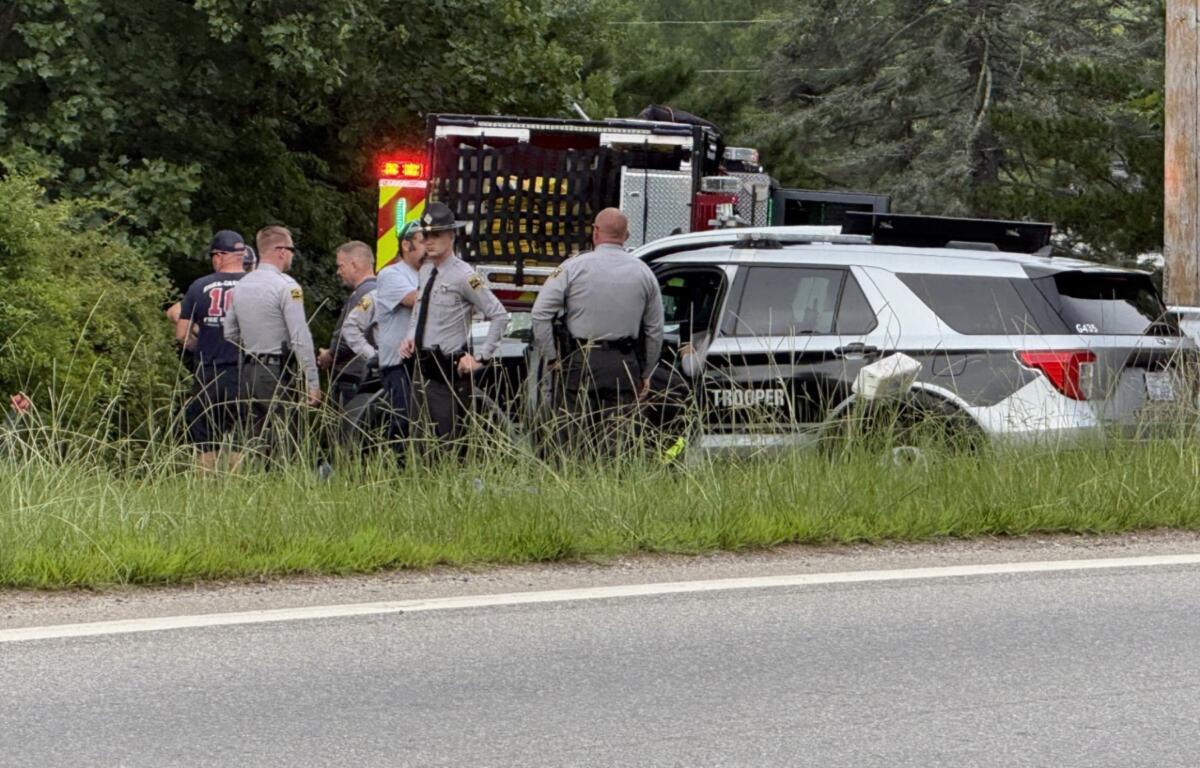 Emergency medical personnel and North Carolina State Highway Patrol troopers respond Tuesday morning, Aug. 4, 2026, to a serious crash on Pisgah Highway near Mountain Home Drive in Candler.