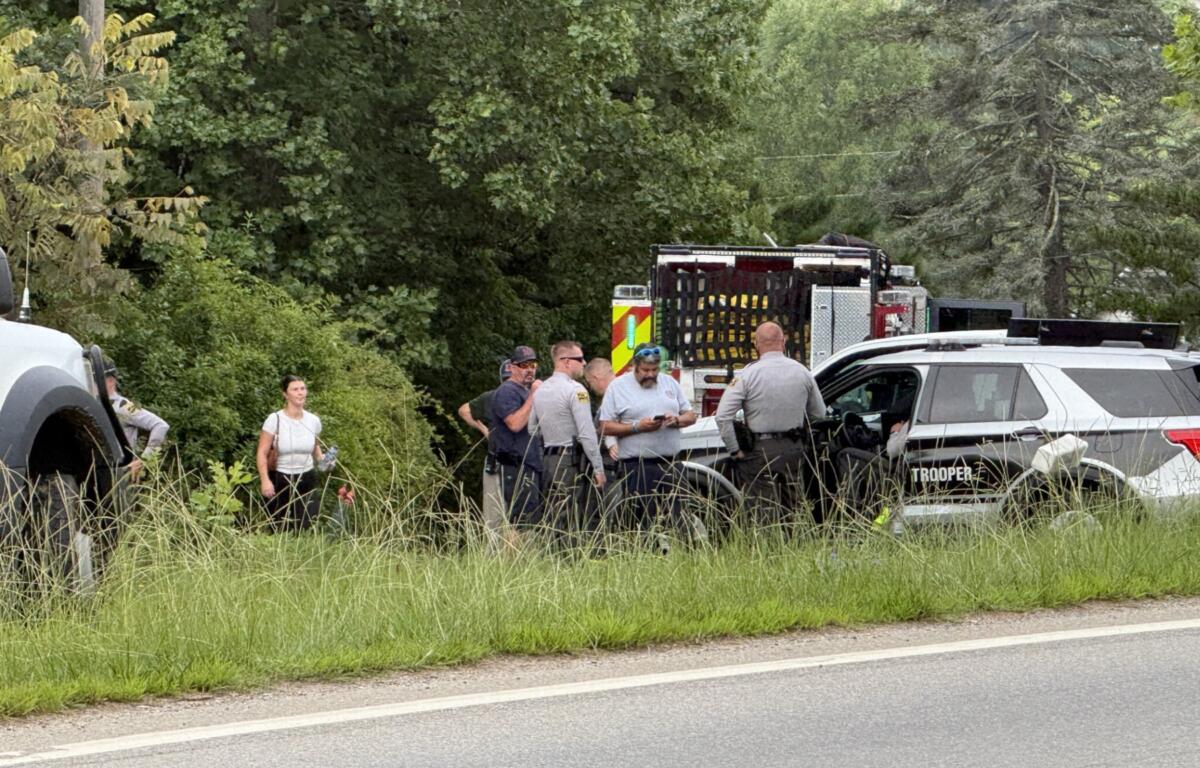 Emergency medical personnel and North Carolina State Highway Patrol troopers respond Tuesday morning, Aug. 4, 2026, to a serious crash on Pisgah Highway near Mountain Home Drive in Candler.