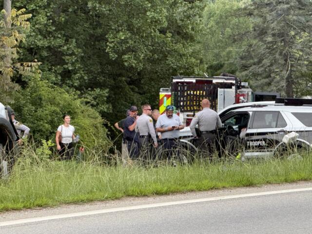 Emergency medical personnel and North Carolina State Highway Patrol troopers respond Tuesday morning, Aug. 4, 2026, to a serious crash on Pisgah Highway near Mountain Home Drive in Candler.