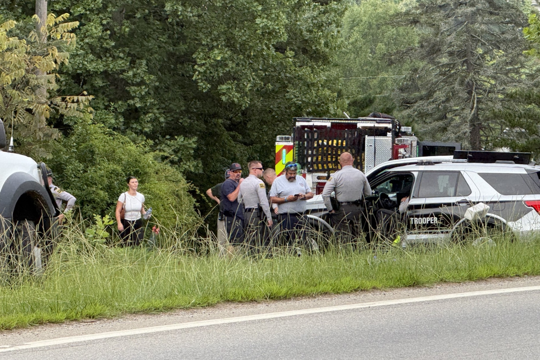 Emergency medical personnel and North Carolina State Highway Patrol troopers respond Tuesday morning, Aug. 4, 2026, to a serious crash on Pisgah Highway near Mountain Home Drive in Candler.