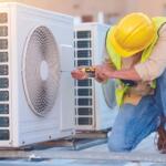 HVAC technician performing maintenance on an outdoor air conditioning unit.
