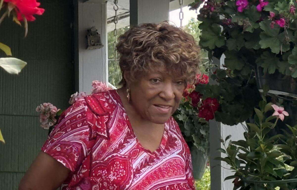 Barbara Payne, a longtime Shiloh resident, discusses concerns about development, preserving the neighborhood's history and keeping longtime residents rooted in the community during a neighborhood walk Wednesday, Aug. 12, 2026, in Asheville.