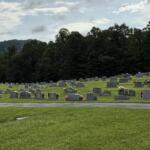 According to obituaries, Travis Grant and his mother, Sharon Grant, are buried at Pleasant Grove Baptist Church Cemetery in Fairview. The two were among three members of the Grant family killed in May 2026.