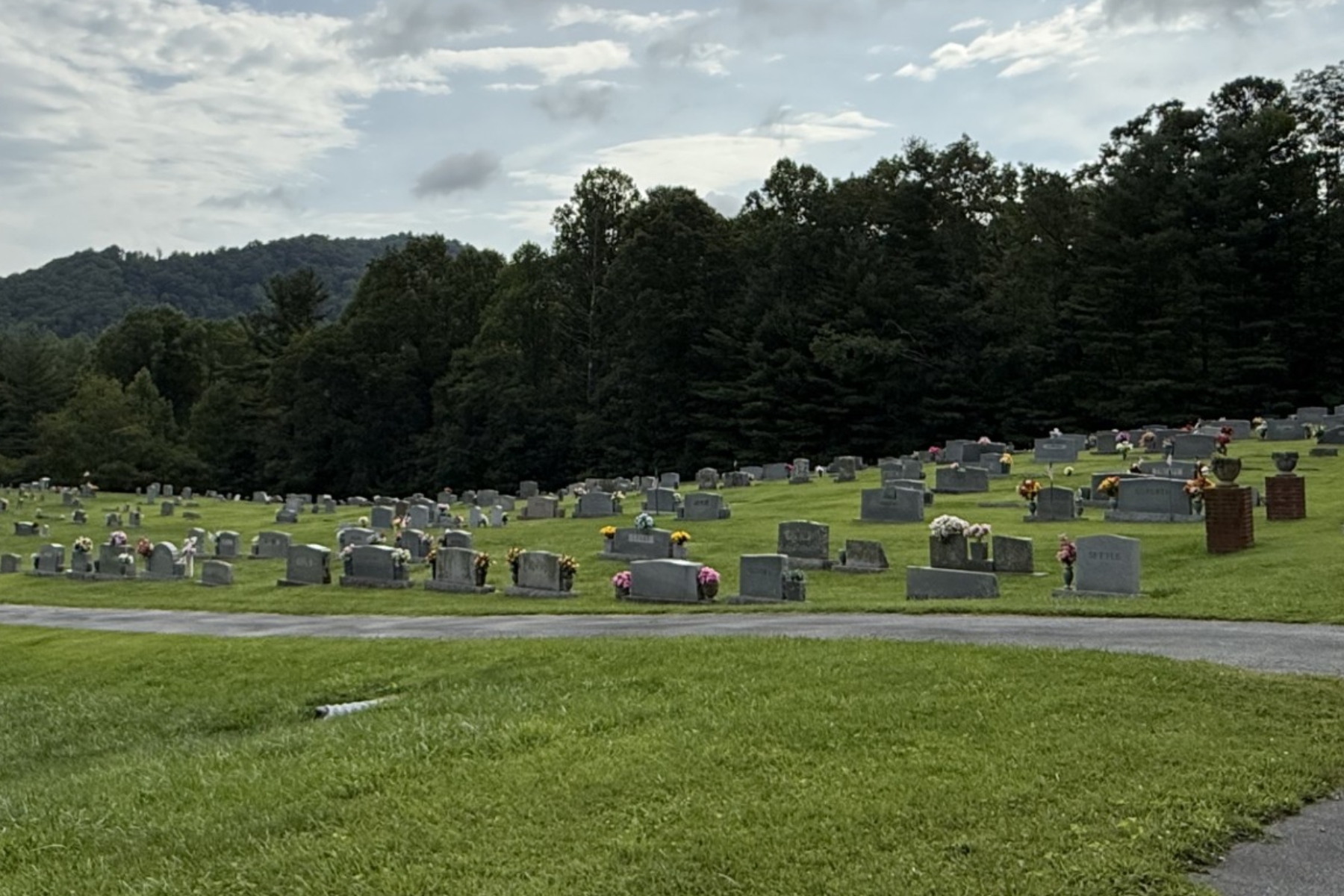 According to obituaries, Travis Grant and his mother, Sharon Grant, are buried at Pleasant Grove Baptist Church Cemetery in Fairview. The two were among three members of the Grant family killed in May 2026.