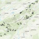 A map shows inventoried roadless areas in and around the Asheville area, including portions of the Pisgah and Nantahala national forests. The areas are among those covered by the federal Roadless Area Conservation Rule, which the U.S. Forest Service has proposed rescinding.