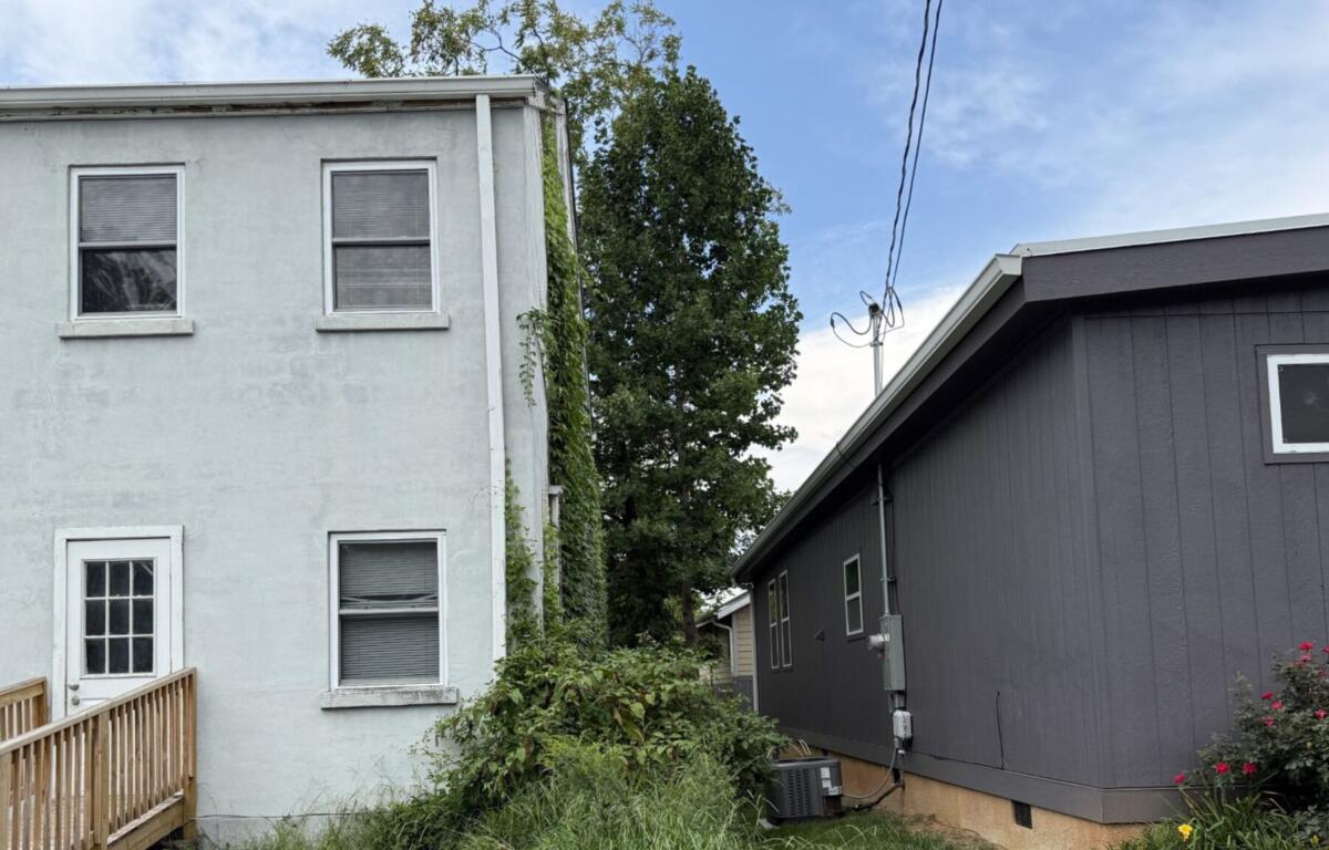 A home built close to Rock Hill Missionary Baptist Church in Asheville's Shiloh neighborhood illustrates concerns raised by residents about new development and preserving the character of the historically Black community.