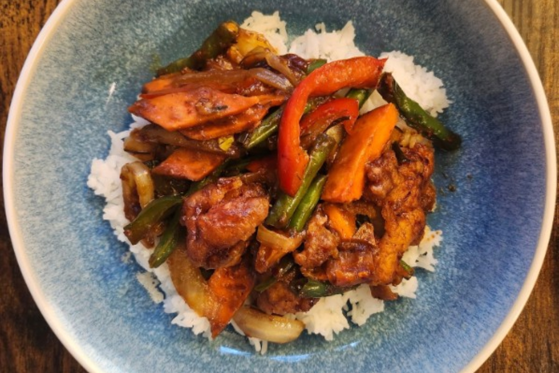 Suwana’s Thai Orchid’s Pad Prik Khing with catfish combines green beans, bell peppers, carrots and kaffir lime leaf in a rich Thai curry stir-fry sauce.