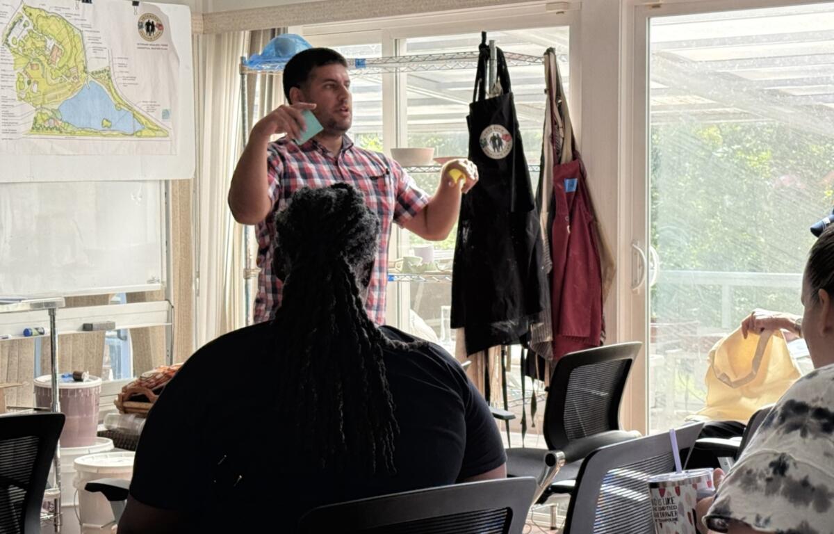 Marc Holaday, program manager for Service Members, Veterans and their Families engagement and outreach at the Governor’s Institute, speaks during the North Carolina Governor’s Working Group Collaboration Lab on Tuesday, Aug. 18, 2026, at the Veterans Healing Farm in Mills River.