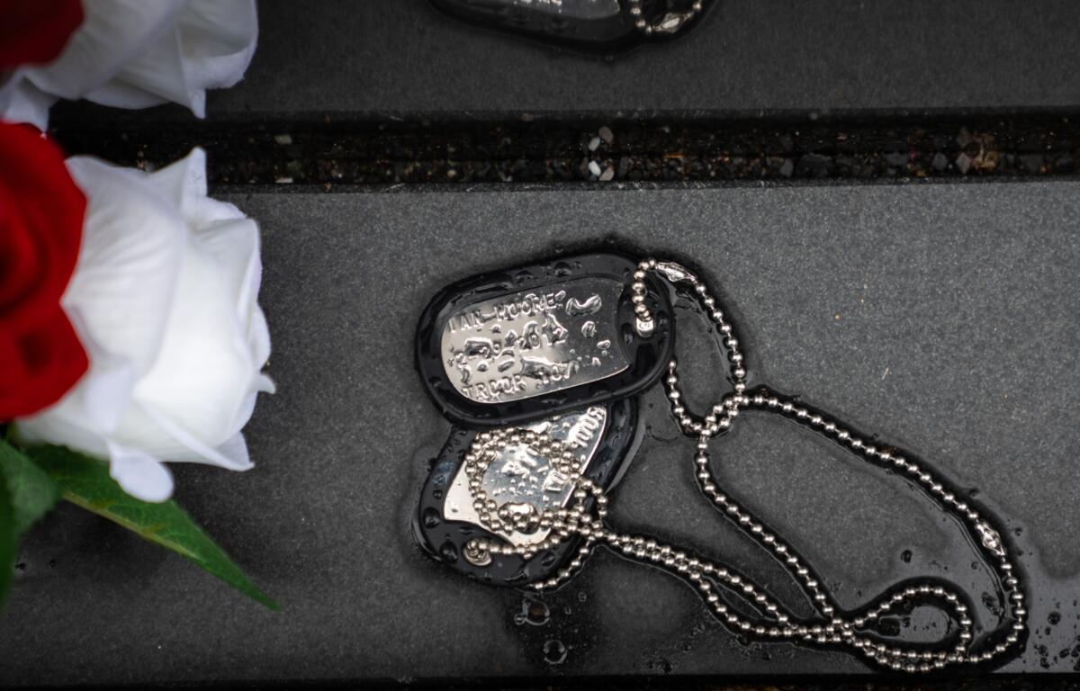 Military dog tags are pictured at the Vietnam Veterans Memorial on Memorial Day, Monday, May 25, 2026, in Washington. (AP Photo/Allison Robbert)