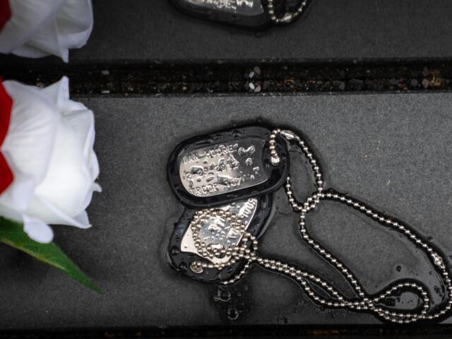 Military dog tags are pictured at the Vietnam Veterans Memorial on Memorial Day, Monday, May 25, 2026, in Washington. (AP Photo/Allison Robbert)