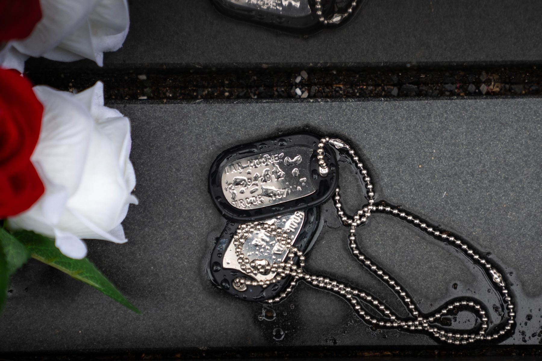 Military dog tags are pictured at the Vietnam Veterans Memorial on Memorial Day, Monday, May 25, 2026, in Washington. (AP Photo/Allison Robbert)