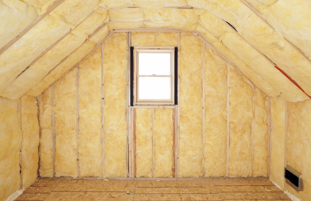 Unfinished attic with yellow insulation between wall studs and a small centered window on the back wallUnfortunately this is too long to display properly.