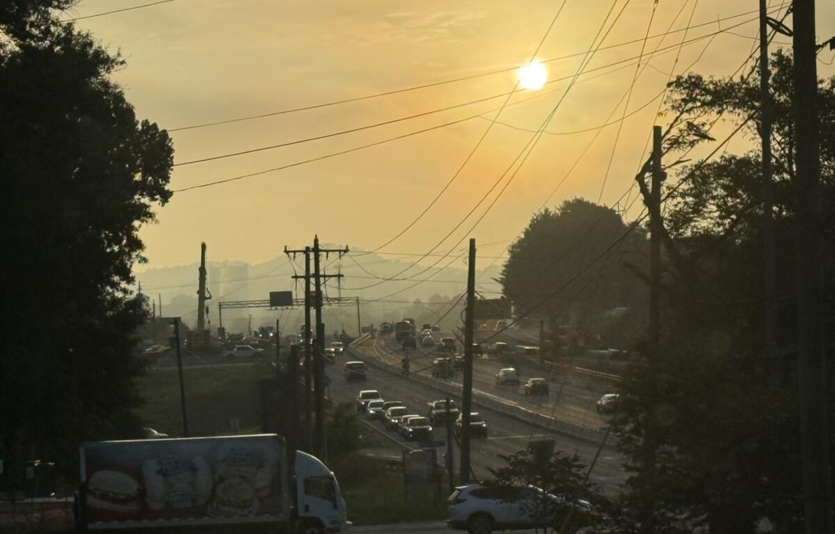 The sun rises over a section of Interstate 26 in Asheville where work is underway on the I-26 Connector project.
