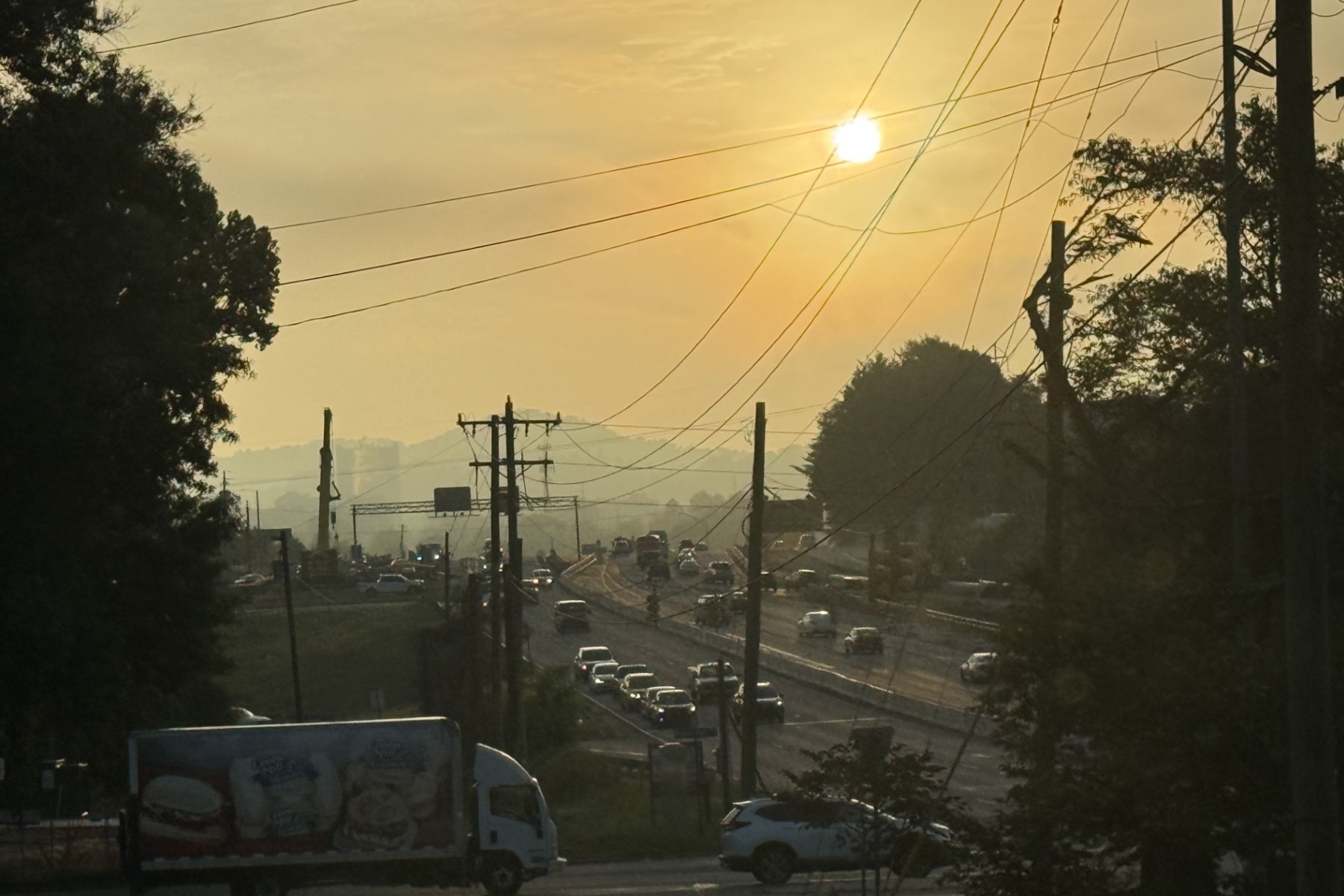 The sun rises over a section of Interstate 26 in Asheville where work is underway on the I-26 Connector project.