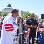 Activists with the Poor People's Campaign led by Rev. William Barber, left, protest against spending reductions across Medicaid, food stamps and federal aid in President Donald Trump's spending and tax bill being worked on by Senate Republicans this week, outside the Supreme Court in Washington, Monday, June 2, 2025. (AP Photo/J. Scott Applewhite)