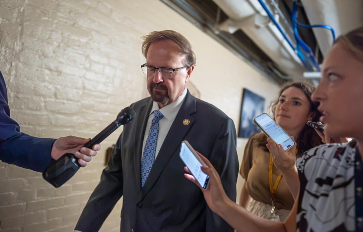 Rep. Chuck Edwards, R-N.C., who is under threat of censure, is met by reporters as he walks to a closed-door meeting with Republican lawmakers at the Capitol in Washington, Tuesday, Sept. 1, 2026. (AP Photo/J. Scott Applewhite)