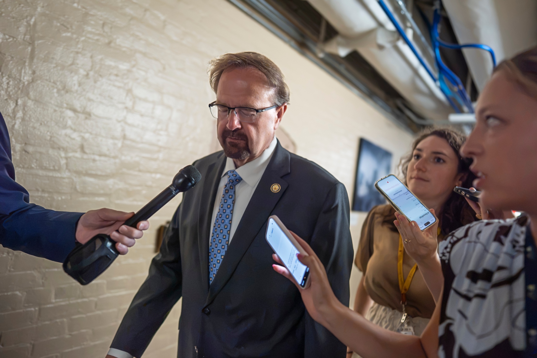 Rep. Chuck Edwards, R-N.C., who is under threat of censure, is met by reporters as he walks to a closed-door meeting with Republican lawmakers at the Capitol in Washington, Tuesday, Sept. 1, 2026. (AP Photo/J. Scott Applewhite)