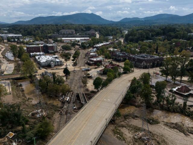 Debris is seen in the aftermath of Hurricane Helene, Monday, Sept. 30, 2024, in Asheville, N.C. (AP Photo/Mike Stewart)