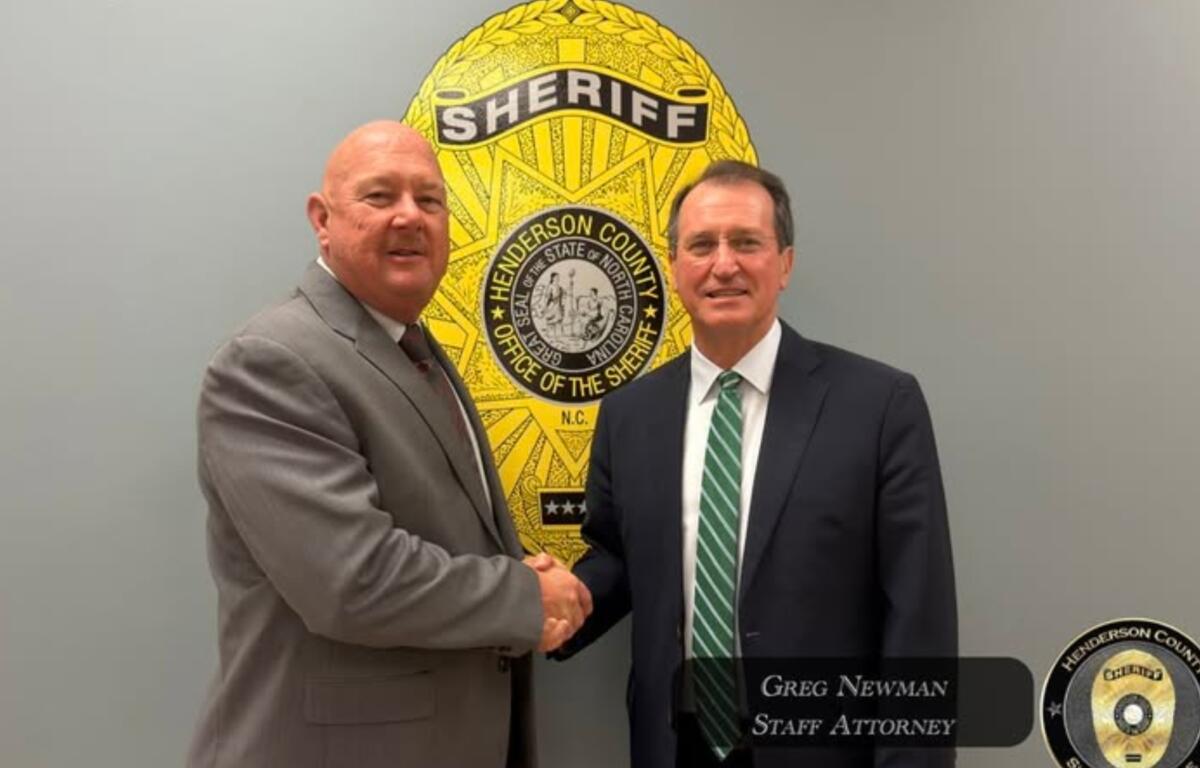 Henderson County Sheriff Lowell Griffin, left, welcomes Greg Newman, the former district attorney for Henderson, Transylvania and Polk counties, to the Henderson County Sheriff's Office.