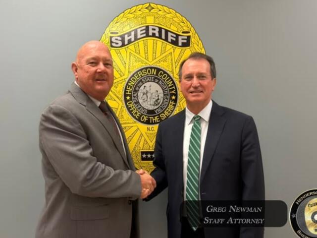 Henderson County Sheriff Lowell Griffin, left, welcomes Greg Newman, the former district attorney for Henderson, Transylvania and Polk counties, to the Henderson County Sheriff's Office.