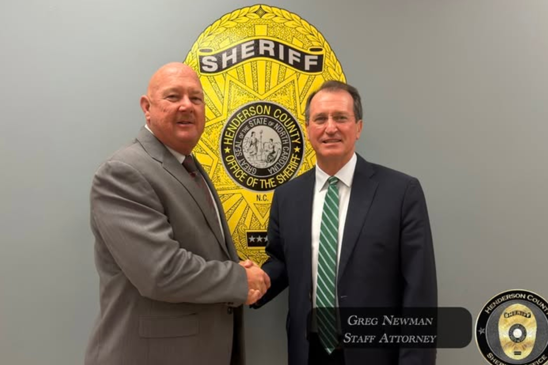 Henderson County Sheriff Lowell Griffin, left, welcomes Greg Newman, the former district attorney for Henderson, Transylvania and Polk counties, to the Henderson County Sheriff's Office.