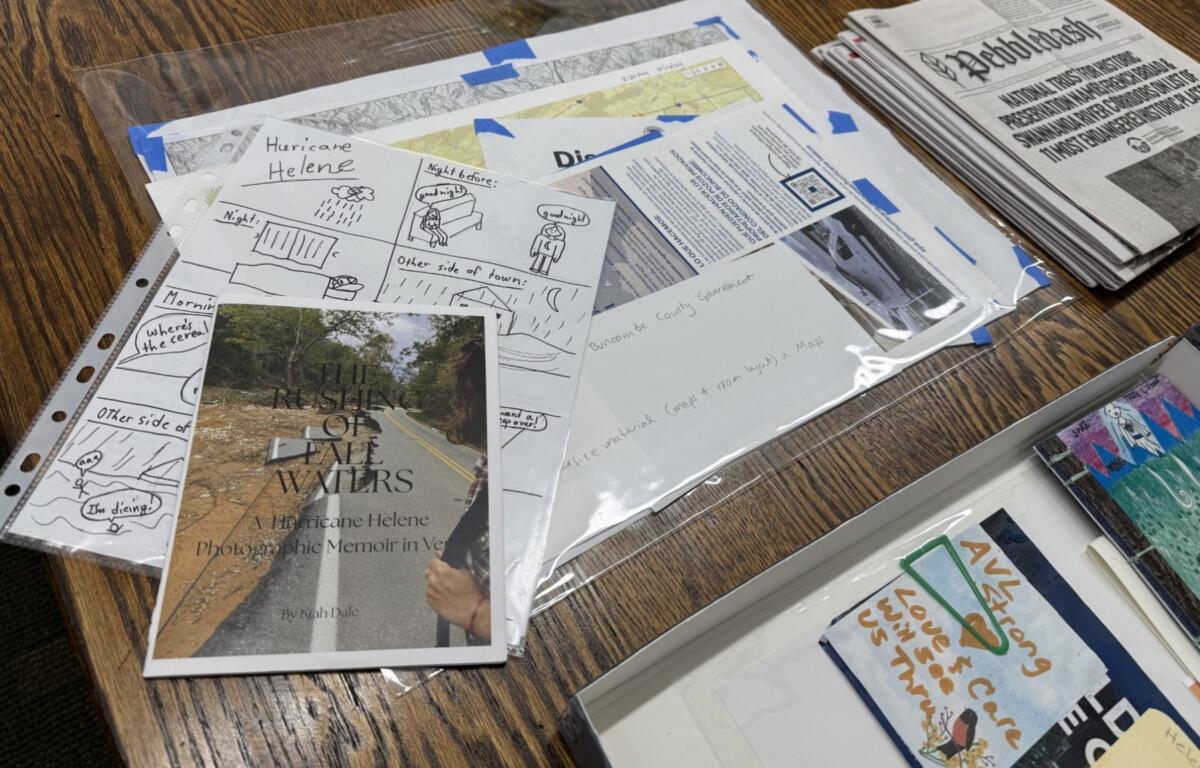Asheville flood playing cards are among the materials documenting the region’s history in the Special Collections area at Pack Memorial Library in Asheville.