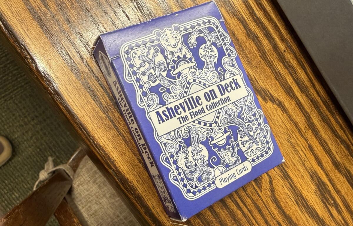 Asheville flood playing cards are among the materials documenting the region’s history in the Special Collections area at Pack Memorial Library in Asheville.