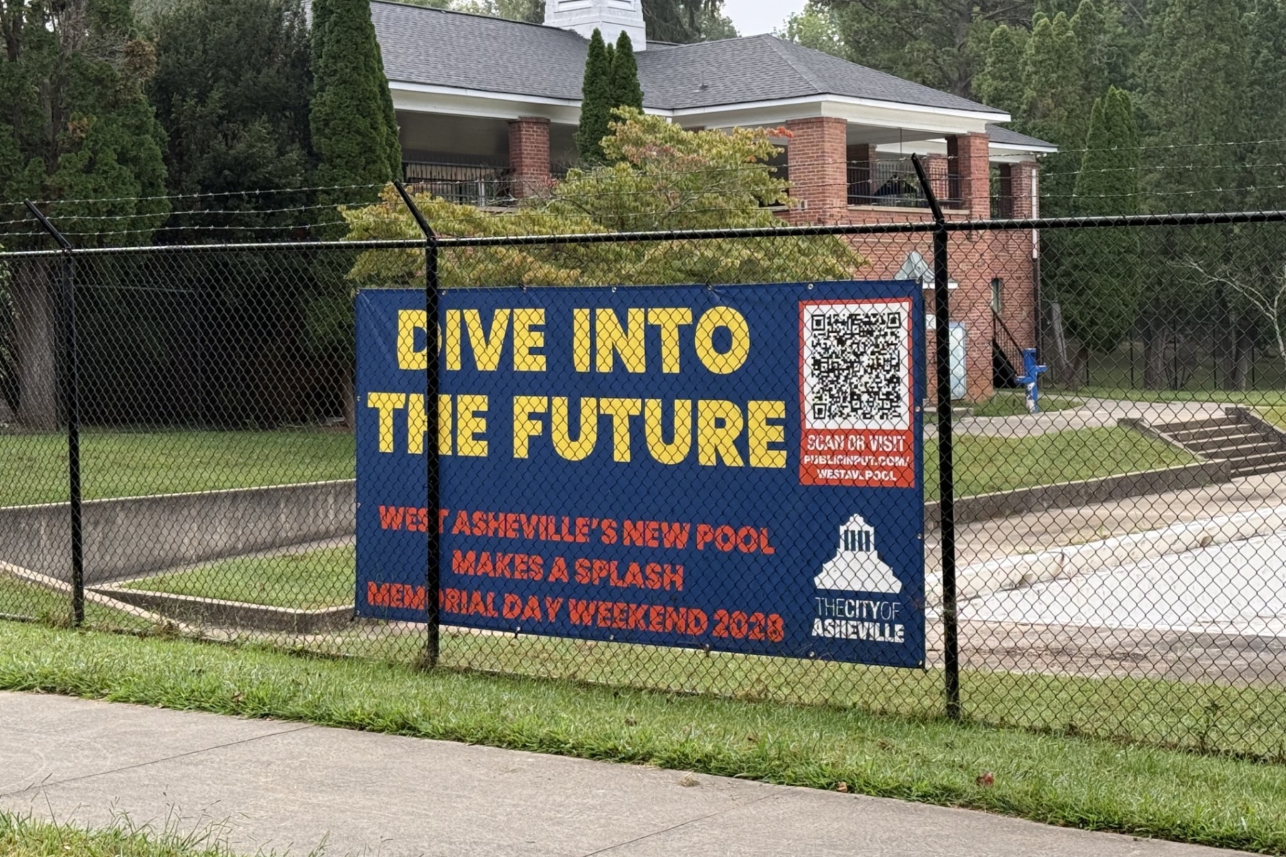The Malvern Hills Park pool sits empty in West Asheville on Sept. 1, 2026. The pool has been closed since 2024 while the city plans to replace the aging facility with a new pool targeted to open in summer 2028.