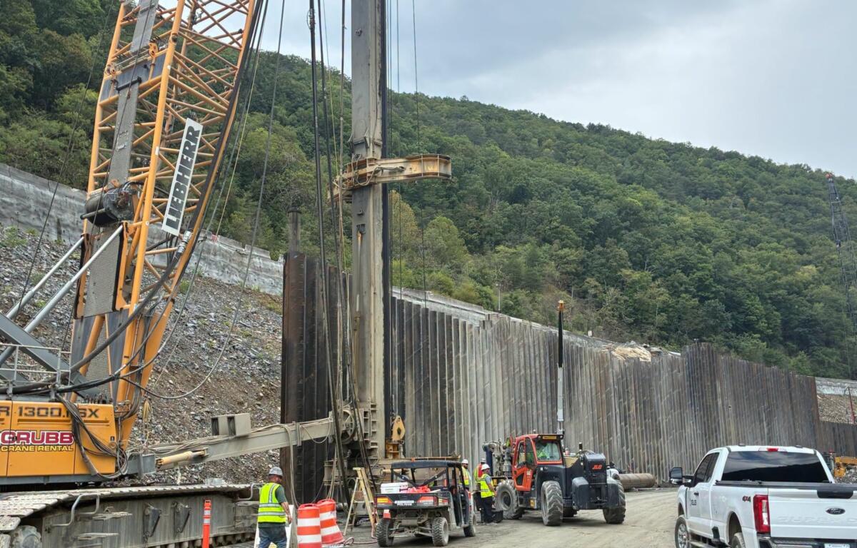 Crews work on the reconstruction of Interstate 40 through the Pigeon River Gorge, where Tropical Storm Helene caused extensive damage in September 2024.