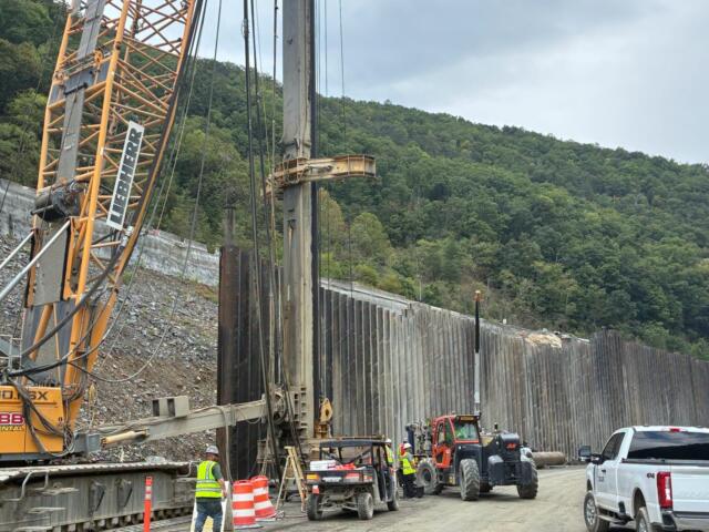 Crews work on the reconstruction of Interstate 40 through the Pigeon River Gorge, where Tropical Storm Helene caused extensive damage in September 2024.